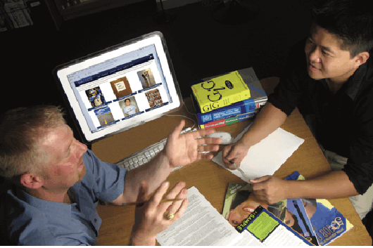 students talking with adviser